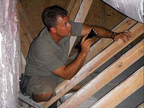 Inspector Checking out an attic